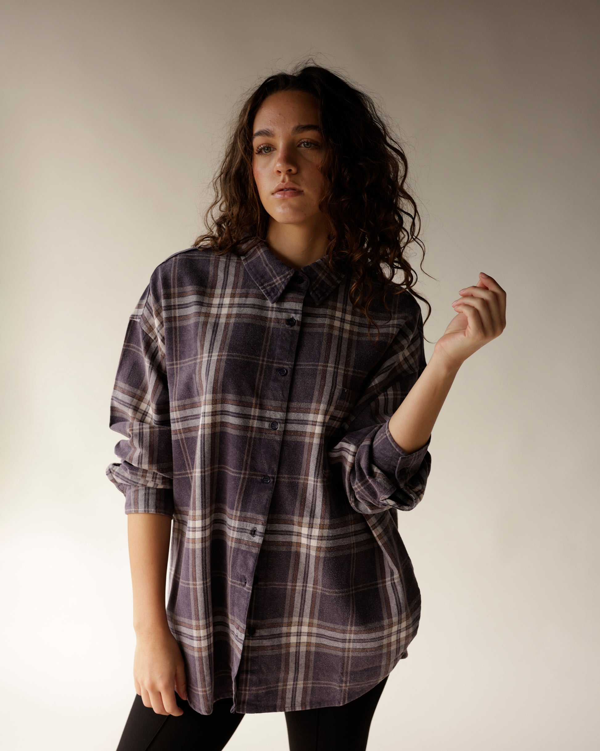 Oversized navy plaid flannel button-up shirt with brown and white checks, rolled cuffs