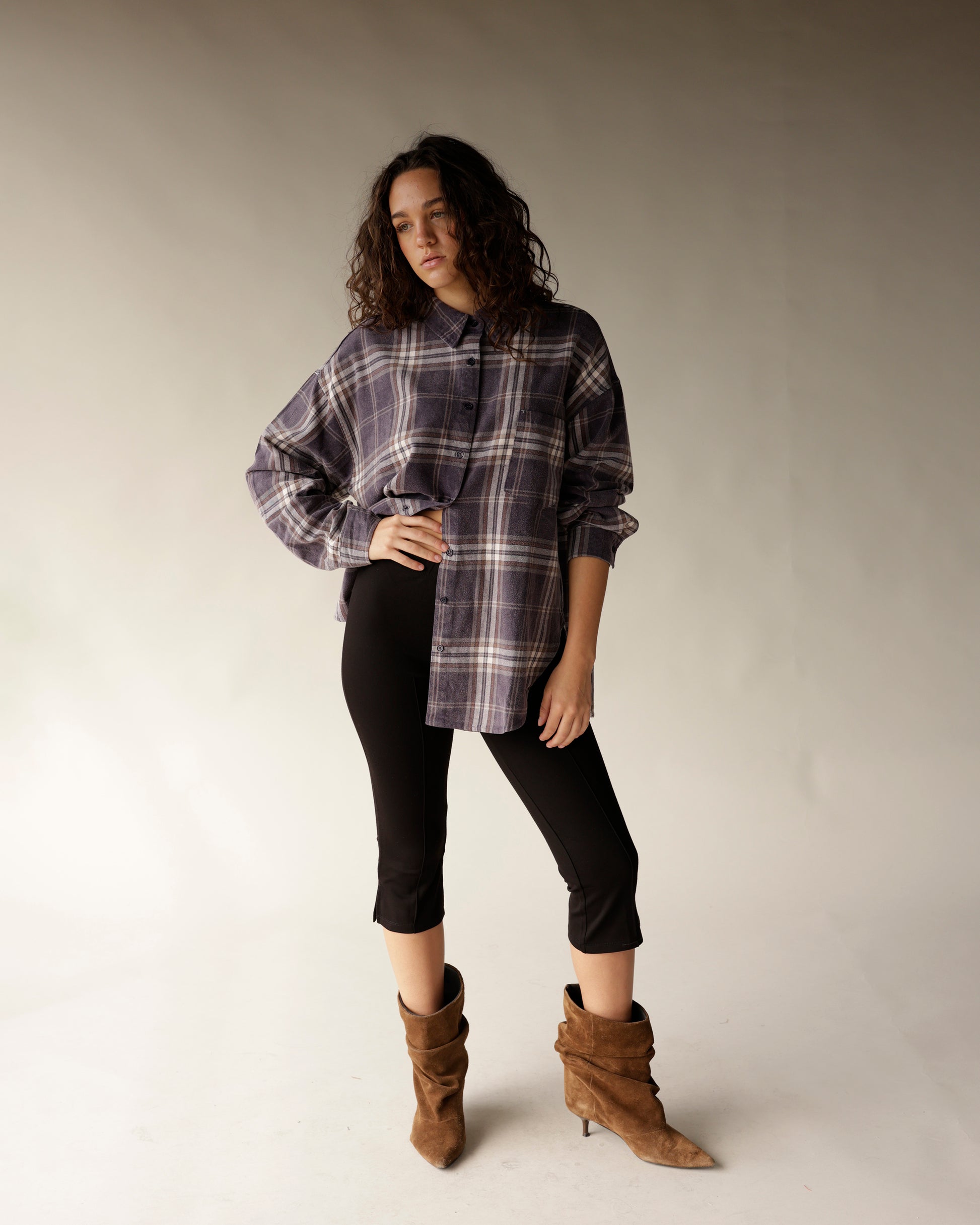 Oversized navy plaid flannel button-up shirt with drop shoulders and chest pocket