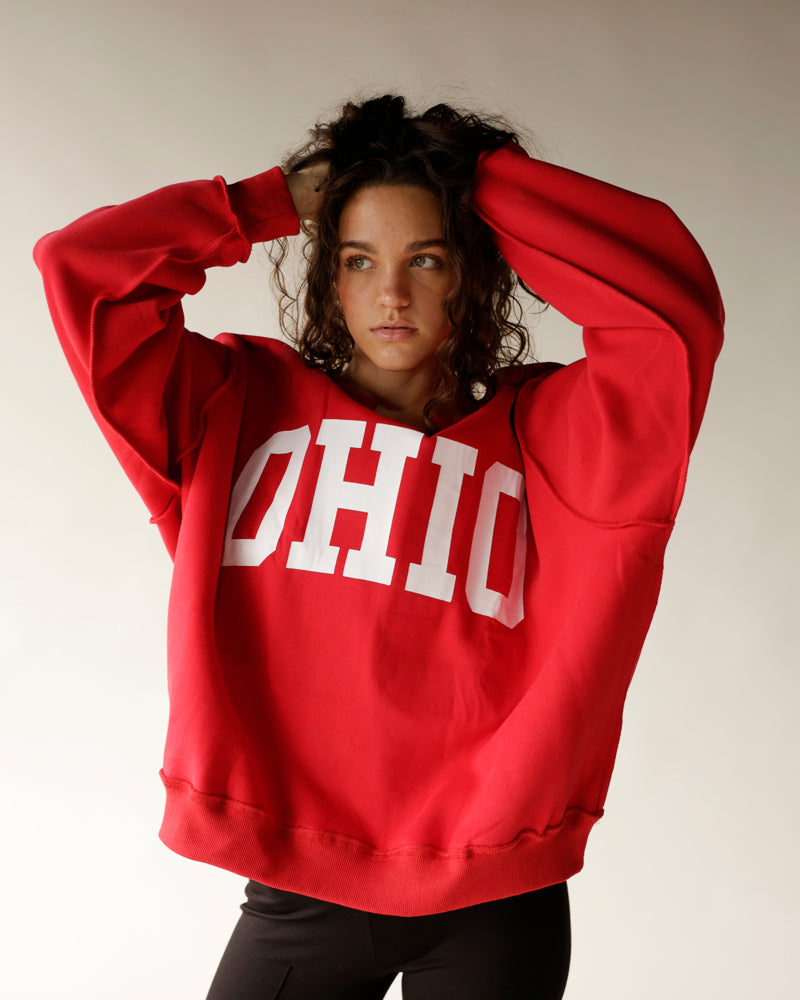 Red Ohio split neck reversible sweatshirt with bold white lettering on model