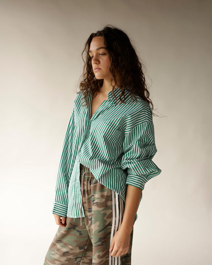 Green and white striped oversized long-sleeve button-up shirt with chest pocket