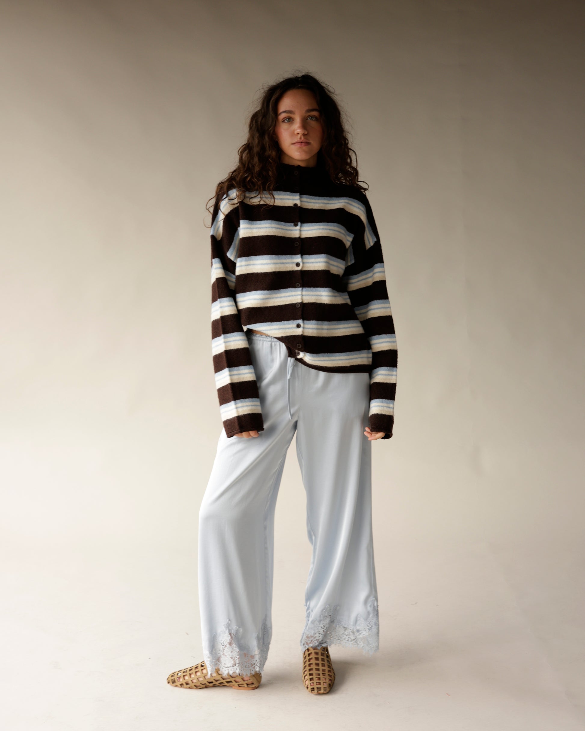 Brown striped mock neck button-up cardigan with blue and cream horizontal stripes