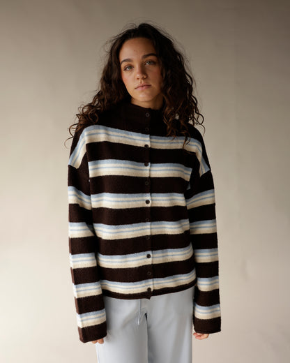 Brown striped mock neck cardigan with cream and blue stripes, button front