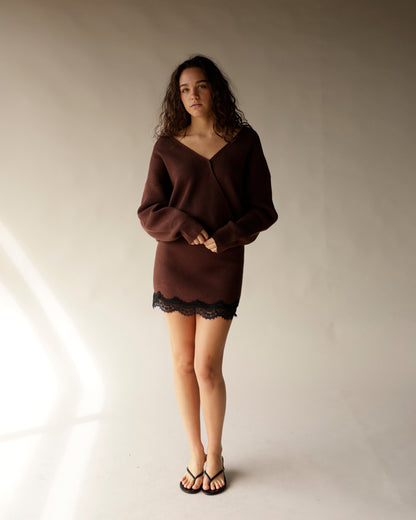 Brown ribbed knit V-neck sweater mini dress with black lace hem and long sleeves