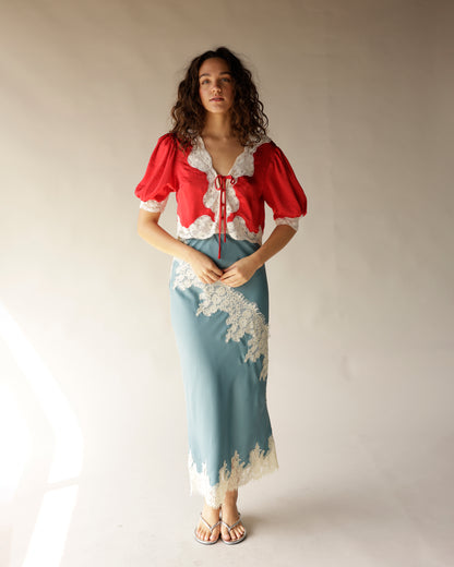 Dusty blue satin midi skirt with ivory lace trim and scalloped hem detail