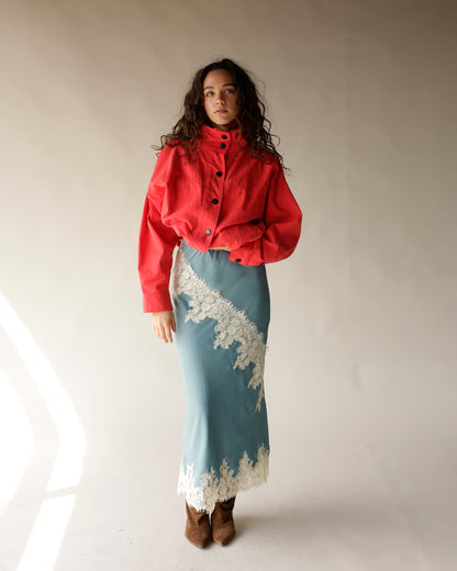 Dusty blue satin midi skirt with diagonal white lace trim detailing
