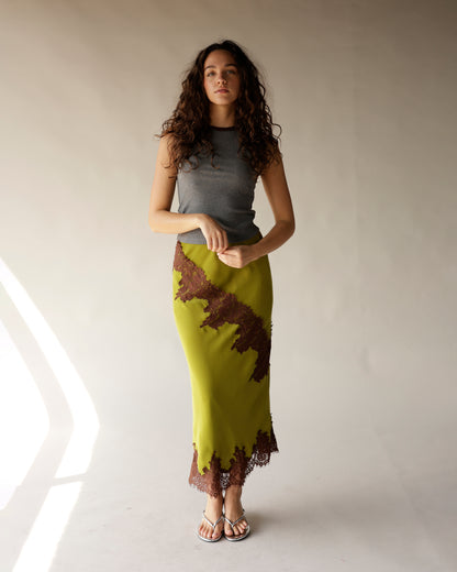 Olive green satin midi skirt with brown lace trim and diagonal lace appliqué detail