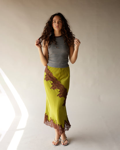 Olive green satin midi skirt with diagonal brown lace trim and hem detail