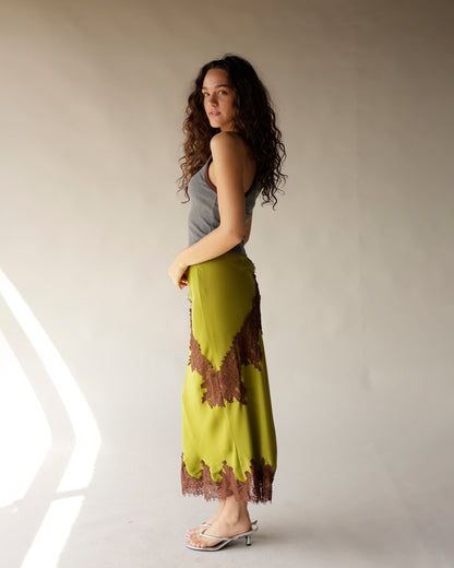 Olive green satin midi skirt with brown lace trim detailing at hem and side