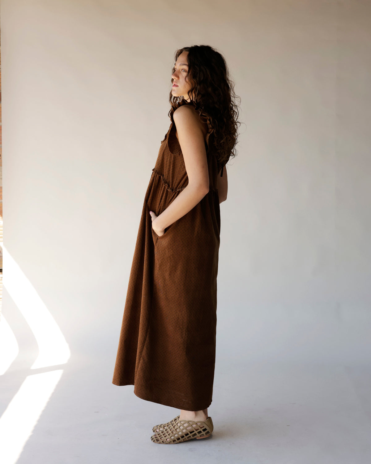 Brown corduroy midi dress with ruffle straps, relaxed fit, and side pockets