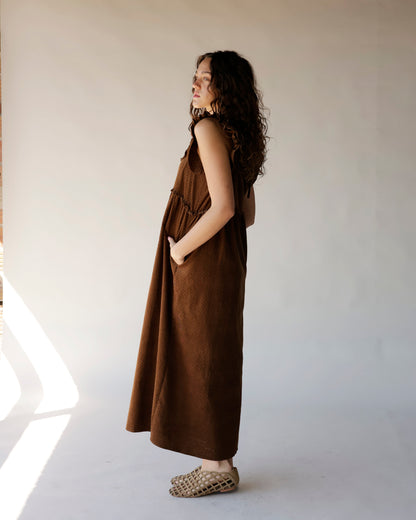 Brown corduroy midi dress with ruffle straps, relaxed fit, and side pockets
