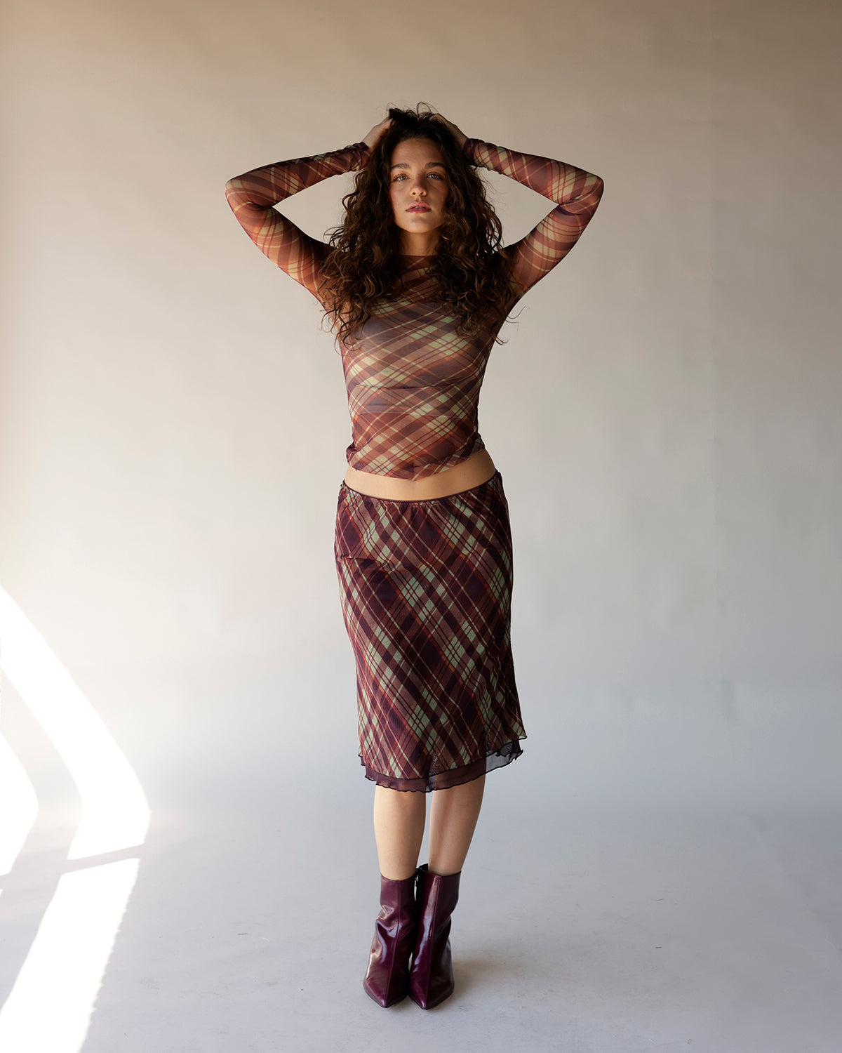 Brown plaid mesh long sleeve crop top with sheer fabric and mock neck