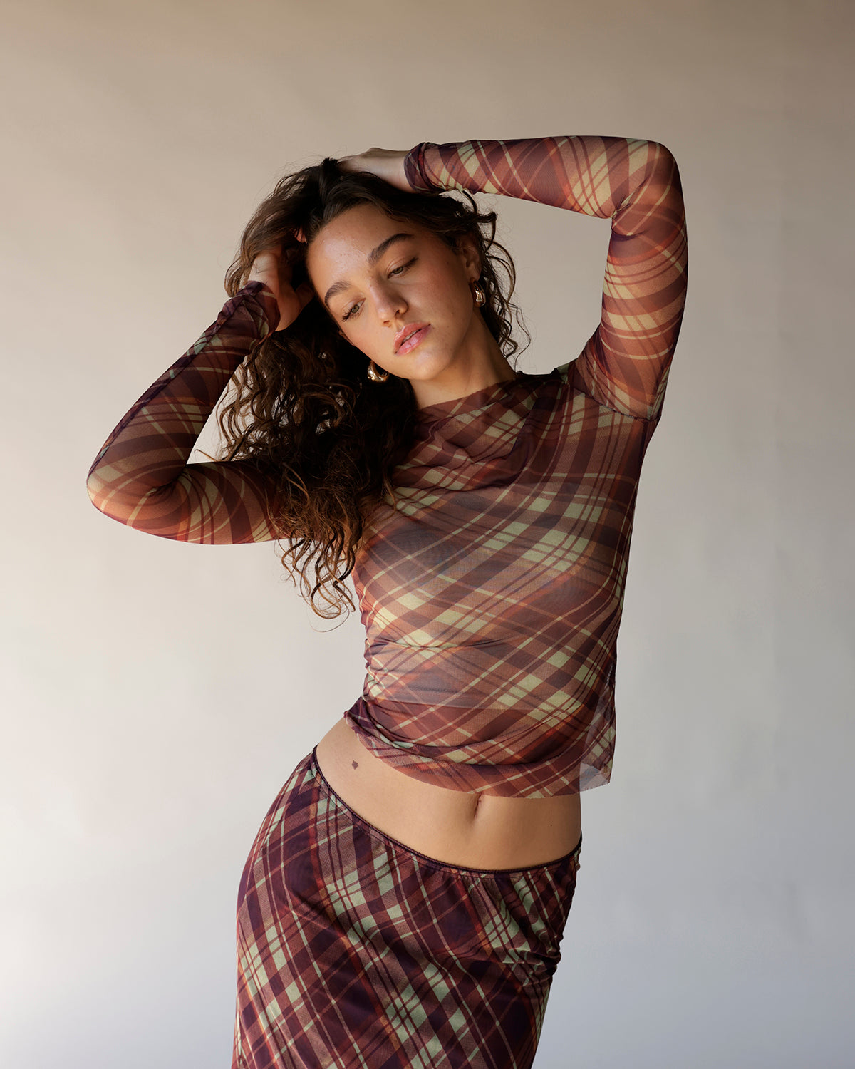Burgundy plaid mesh long sleeve crop top with sheer fabric and fitted silhouette