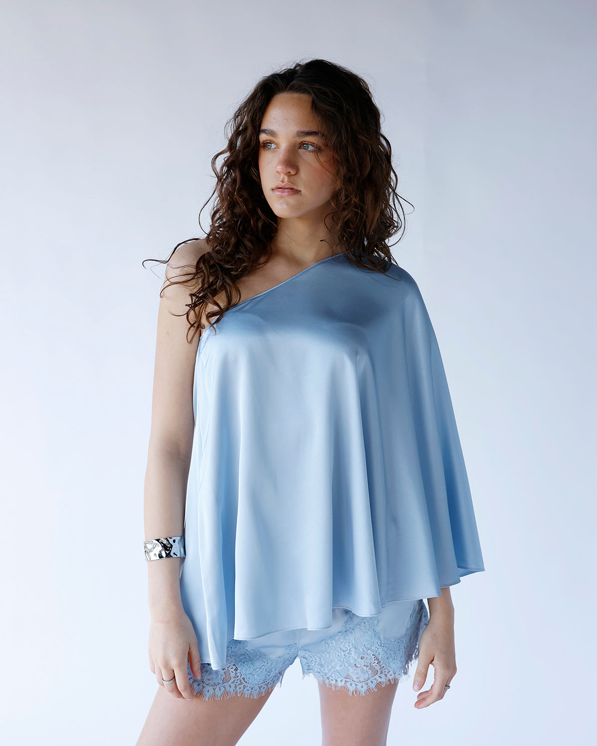 SKYLINE ONE SHOULDER PONCHO TOP