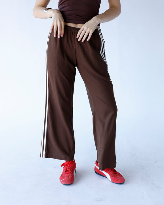 brown wide leg track pants with white track stripes