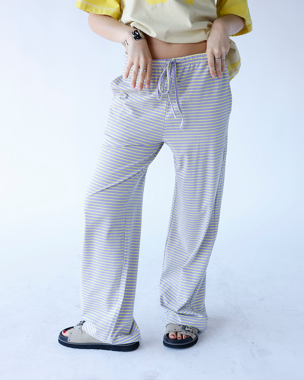 purple and yellow striped wide leg lounge pants with elastic waistband