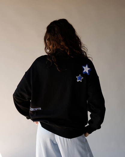 Black Kentucky Wildcats crewneck sweatshirt with blue and white star patches on back