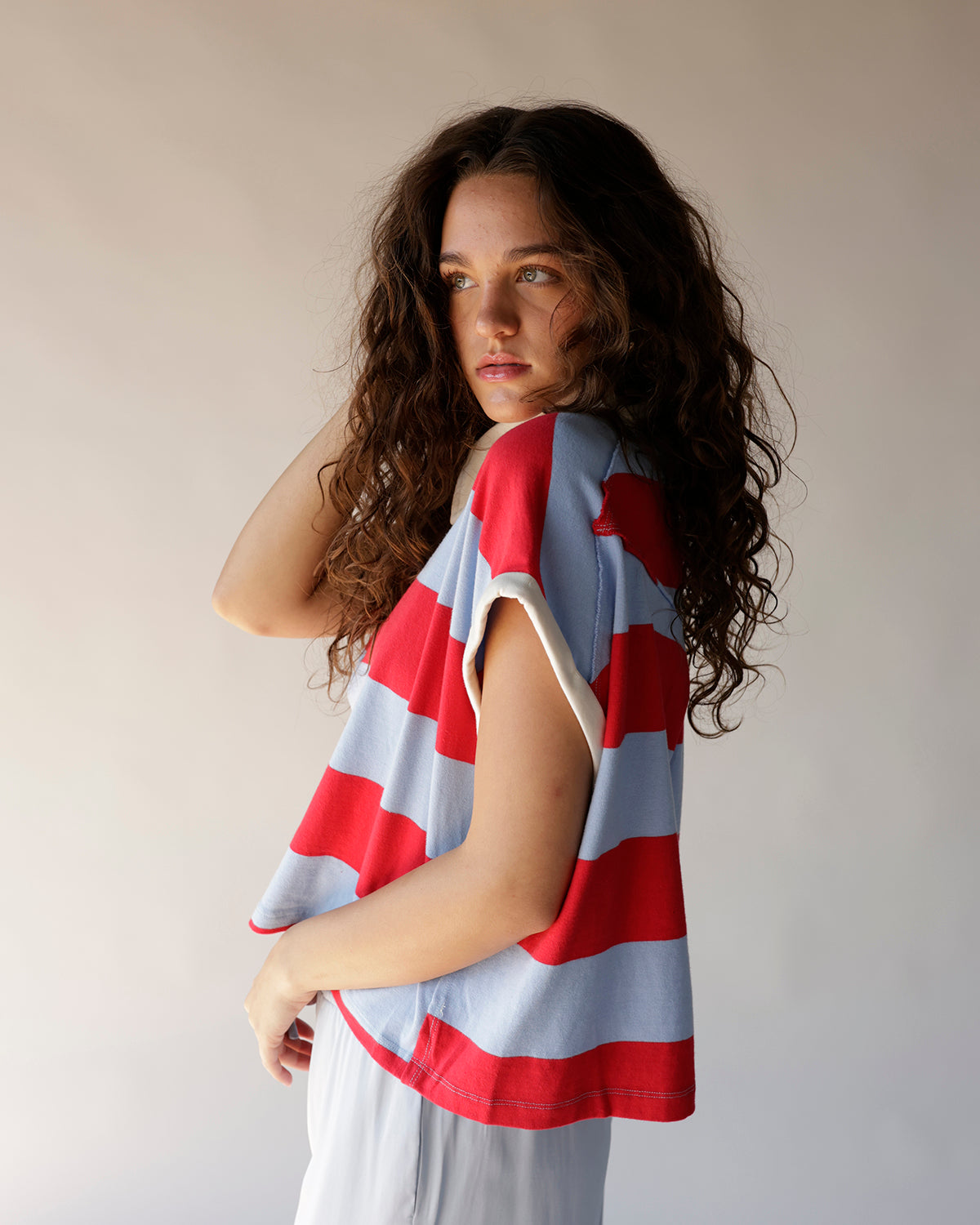 Red and blue wide stripe sleeveless crop polo top with cream trim