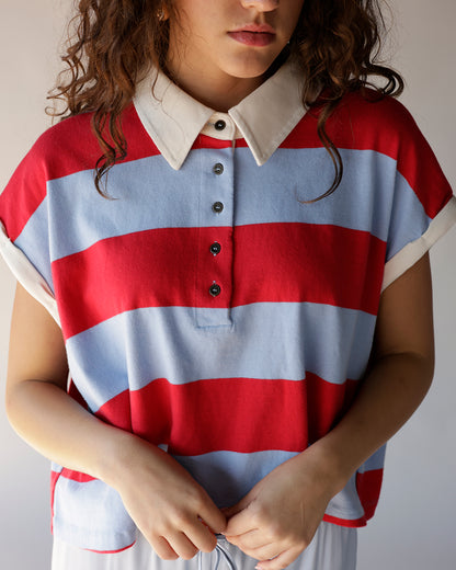 Red and blue wide stripe polo crop top with white collar and black buttons