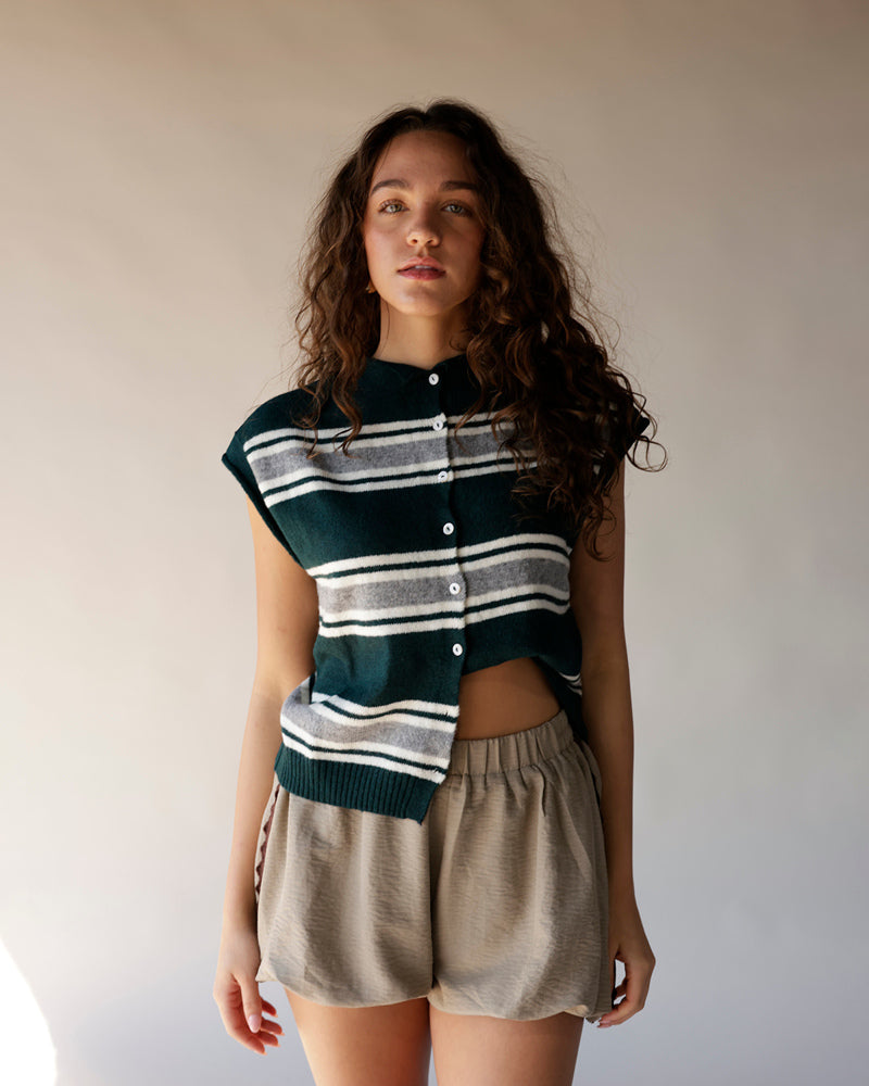Dark teal striped sleeveless knit cardigan vest with white buttons and ribbed hem