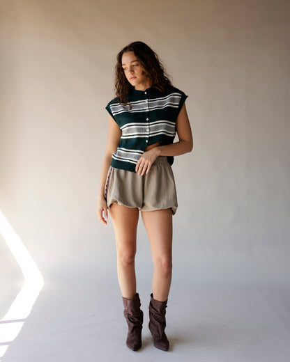 Dark green striped sleeveless knit cardigan vest with white buttons and ribbed hem