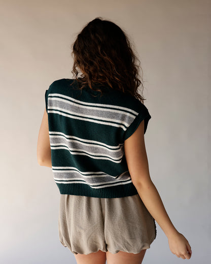 Dark green striped knit vest with white and gray horizontal stripes, back view