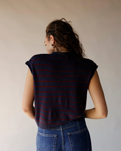 Navy blue striped knit sweater vest with red stripes, back view