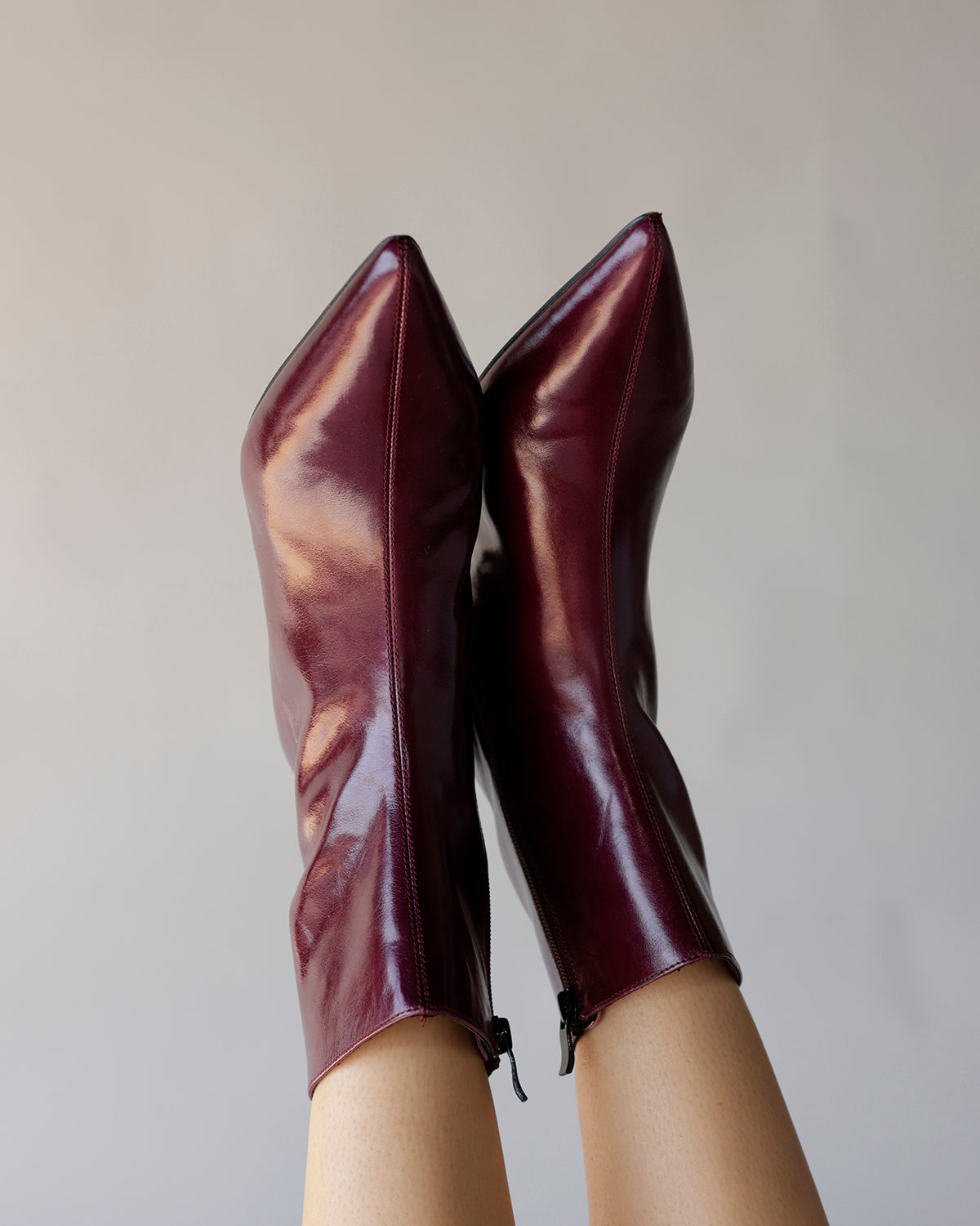 Steve Madden maroon patent leather pointed-toe ankle booties with side zipper