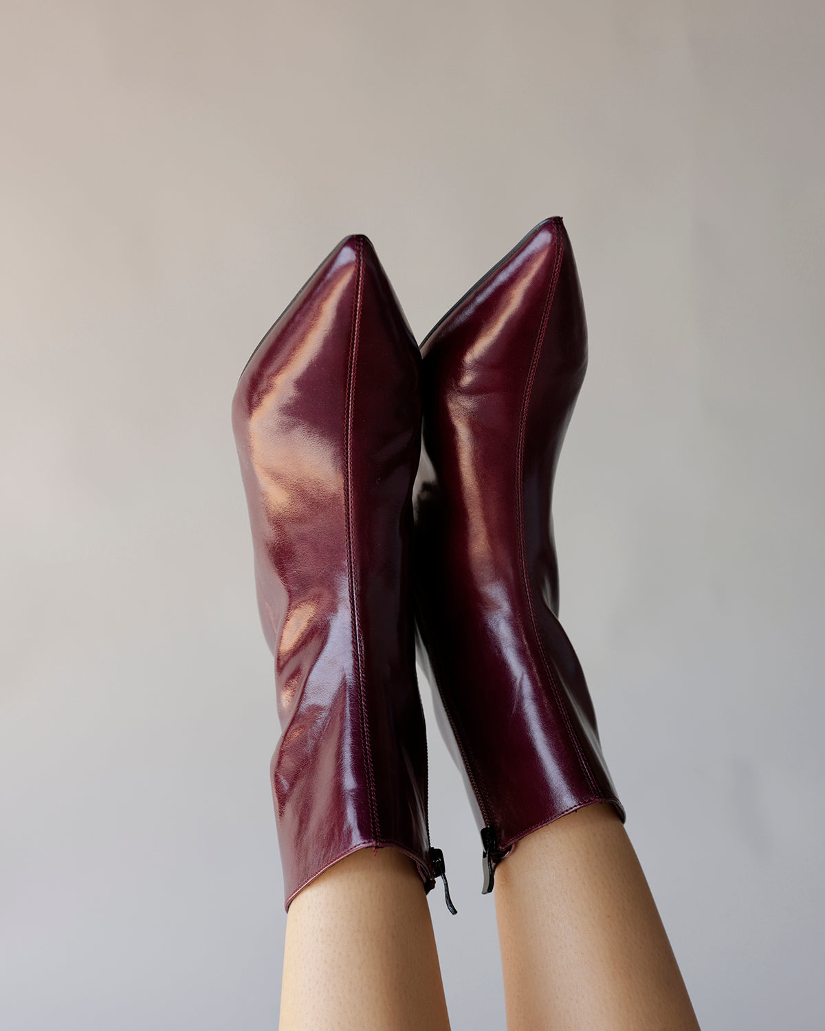 Steve Madden maroon patent leather pointed-toe ankle booties with back zipper