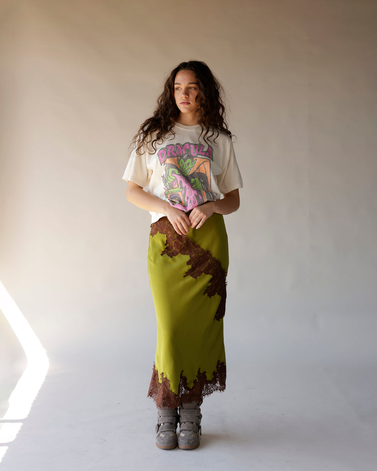 Cream Dracula retro Halloween graphic tee styled with olive satin midi skirt