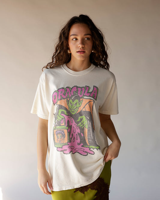 Cream oversized graphic tee with retro Dracula Halloween print in pink and green