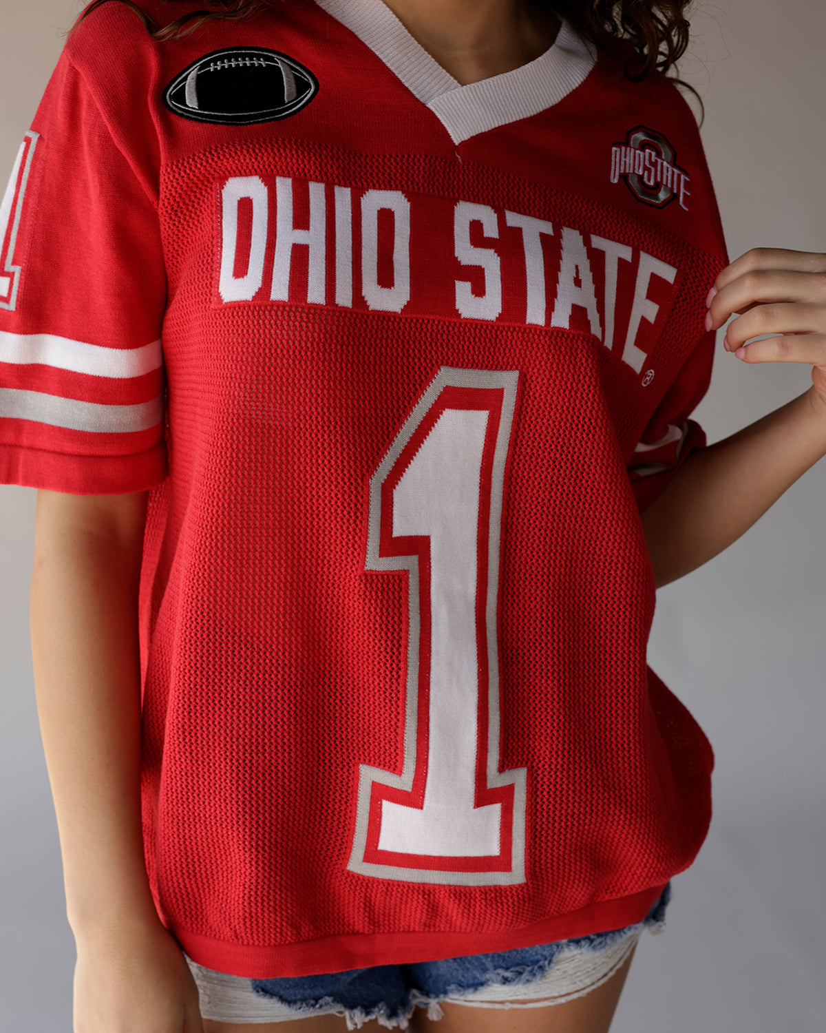 Red Ohio State football jersey number 1 with white lettering and mesh fabric