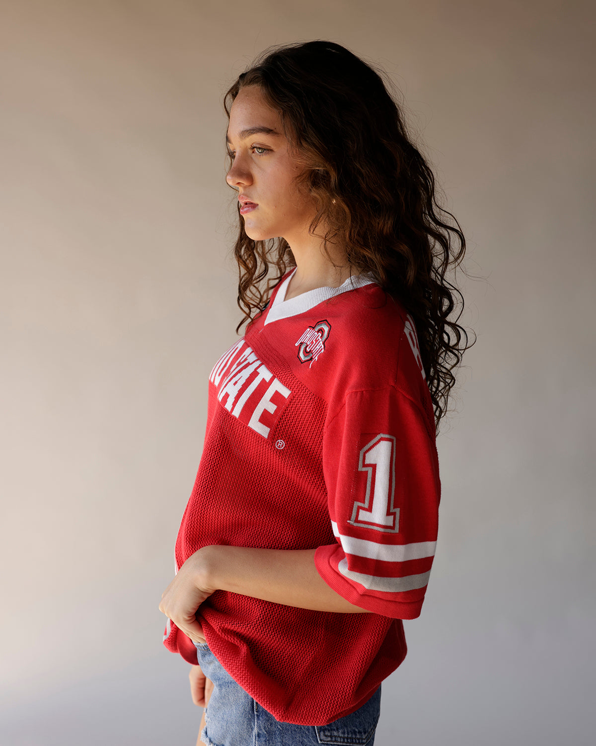 Red Ohio State mesh football jersey with white lettering and number 1 sleeve