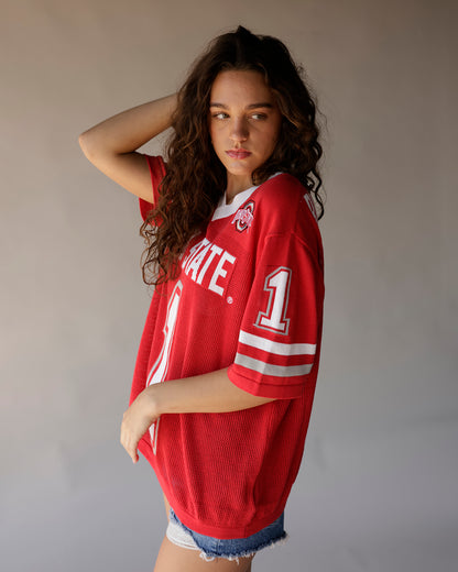 Women's oversized red Ohio State football jersey with white stripes and denim shorts
