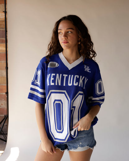 Kentucky Wildcats blue football jersey #01 worn by female model with denim shorts