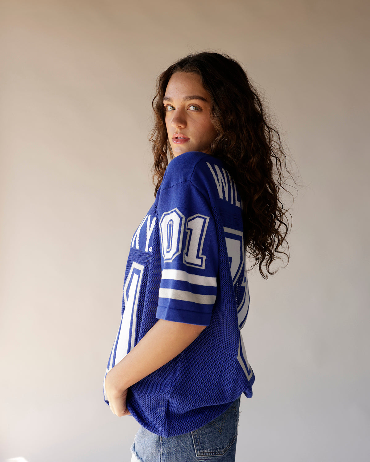 Blue Kentucky Wildcats football jersey with white number 01 and stripe details