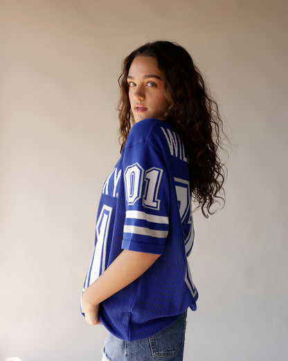 Blue Kentucky Wildcats football jersey with white number 01 and stripe details