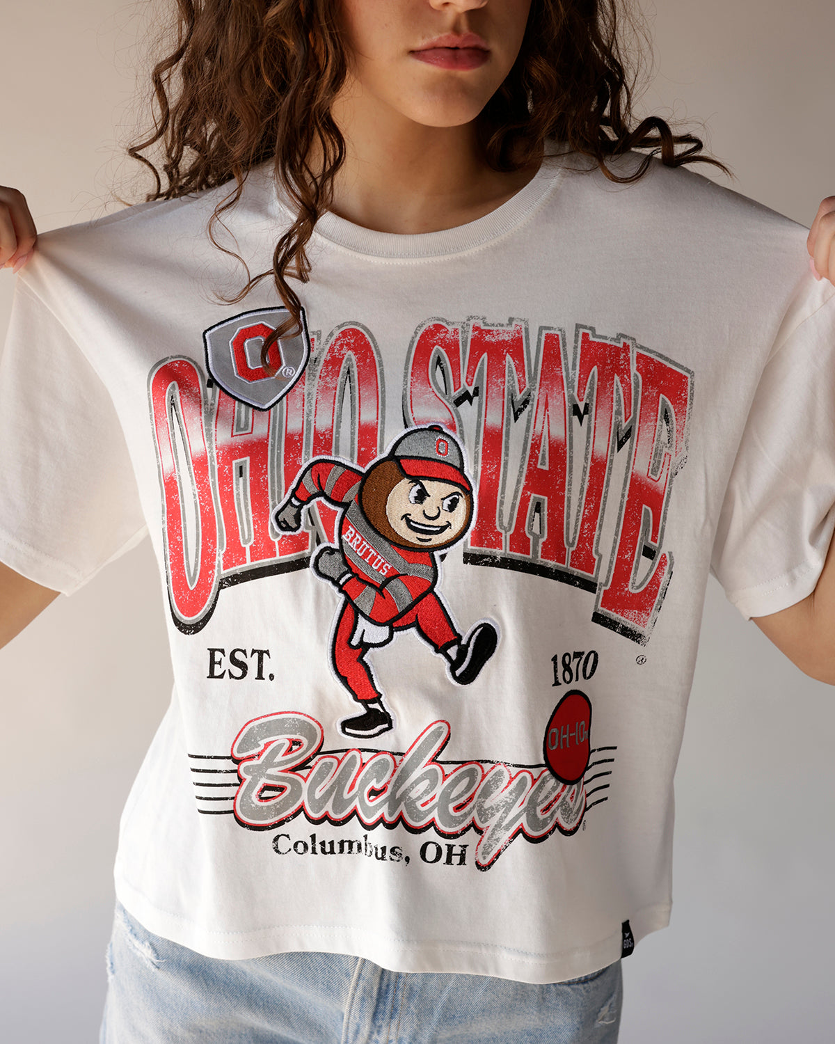 White oversized crop tee with vintage Ohio State Buckeyes Brutus mascot graphic print