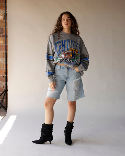 Gray Kentucky Football throwback crewneck sweatshirt with blue stripe sleeves and graphic