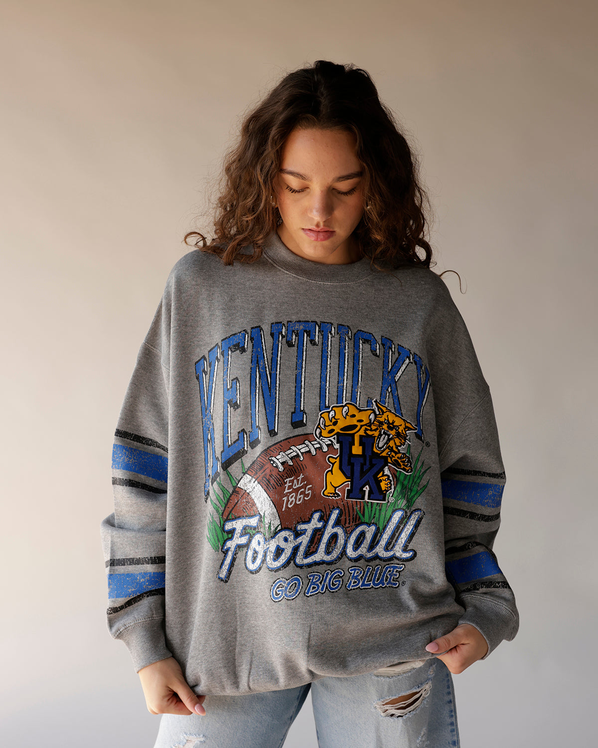Gray Kentucky Football throwback crewneck sweatshirt with vintage graphic and stripe sleeves