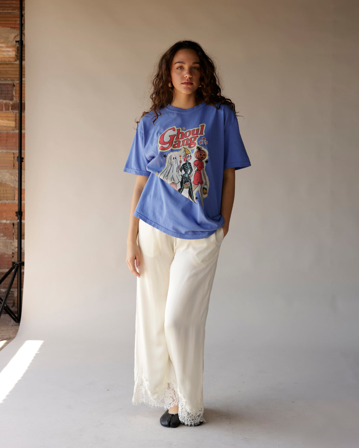 Oversized blue graphic tee with Ghoul Gang Halloween Halloween print, worn tucked loosely