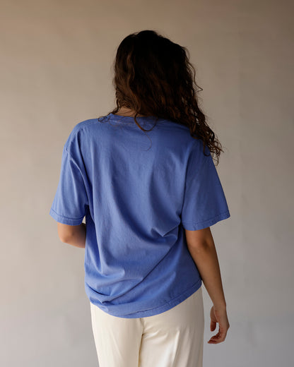 Blue oversized graphic tee shown from back, relaxed fit, short sleeves