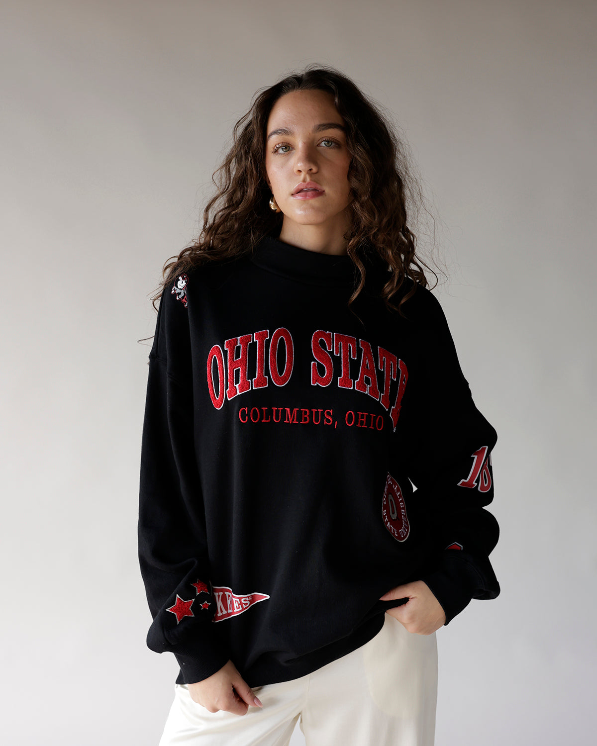 Black oversized crewneck sweatshirt with red Ohio State Columbus Ohio graphic and patches