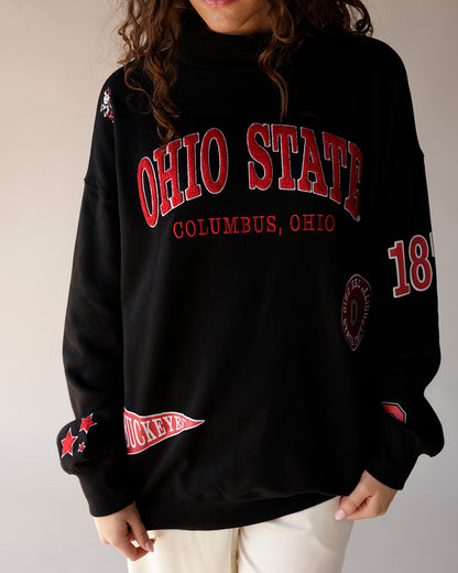 Black mock neck sweatshirt with red Ohio State Columbus Ohio graphics and patches