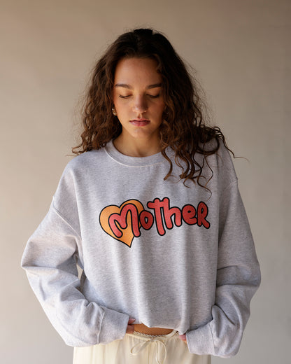 Gray heather crewneck sweatshirt with heart and retro bubble letter graphic