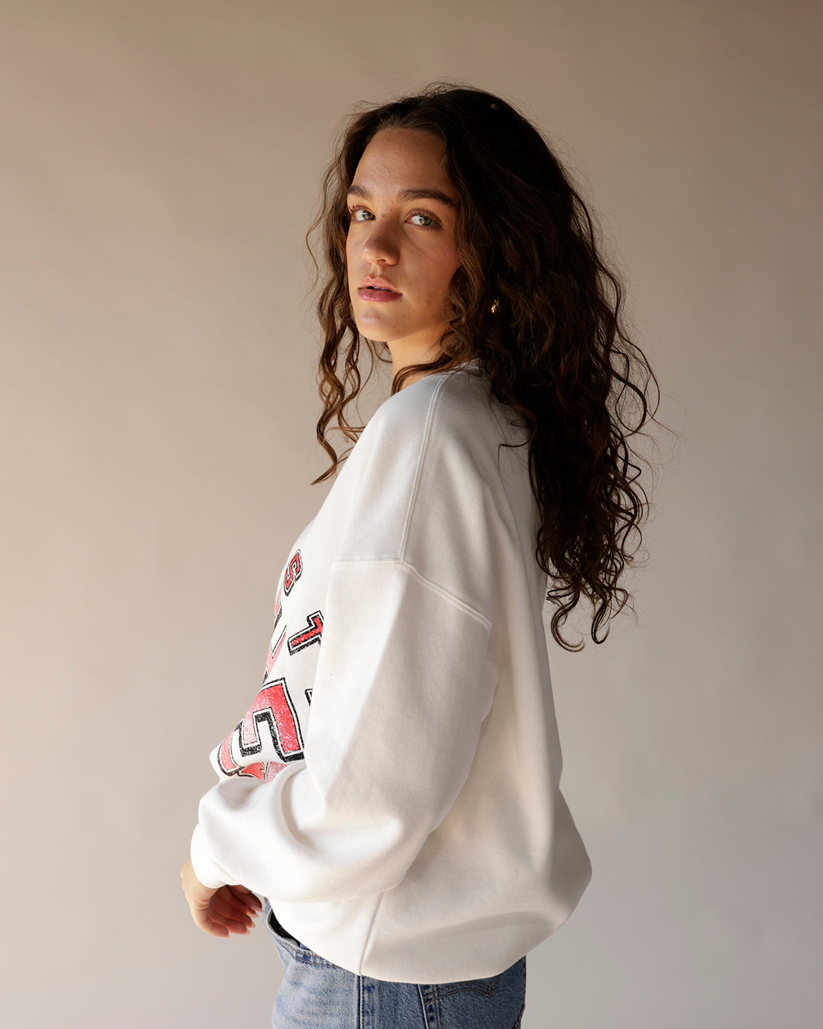 White oversized Ohio State Brutus graphic crewneck sweatshirt with red lettering