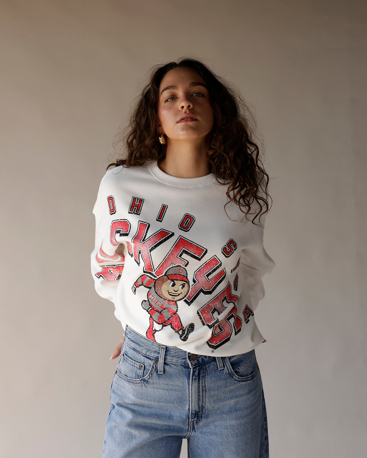 White Ohio State Buckeyes crewneck sweatshirt with Brutus mascot graphic print