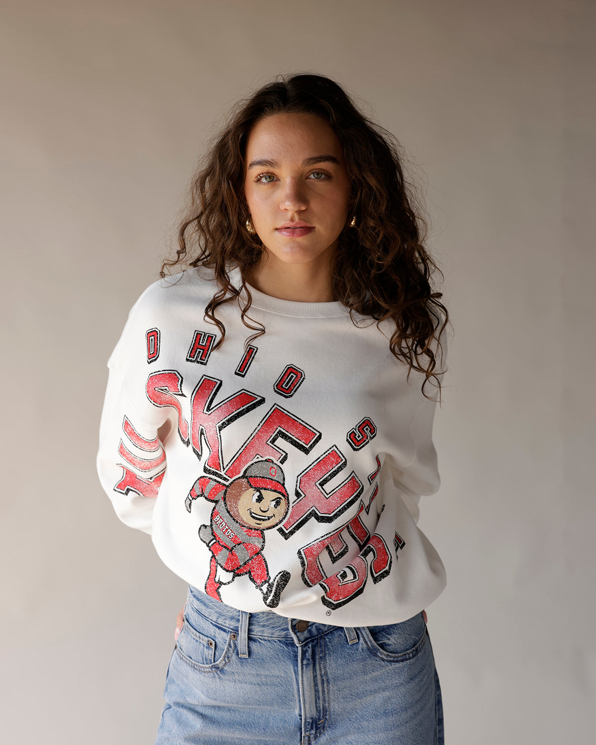 White Ohio State Buckeyes crewneck sweatshirt with Brutus mascot graphic in red