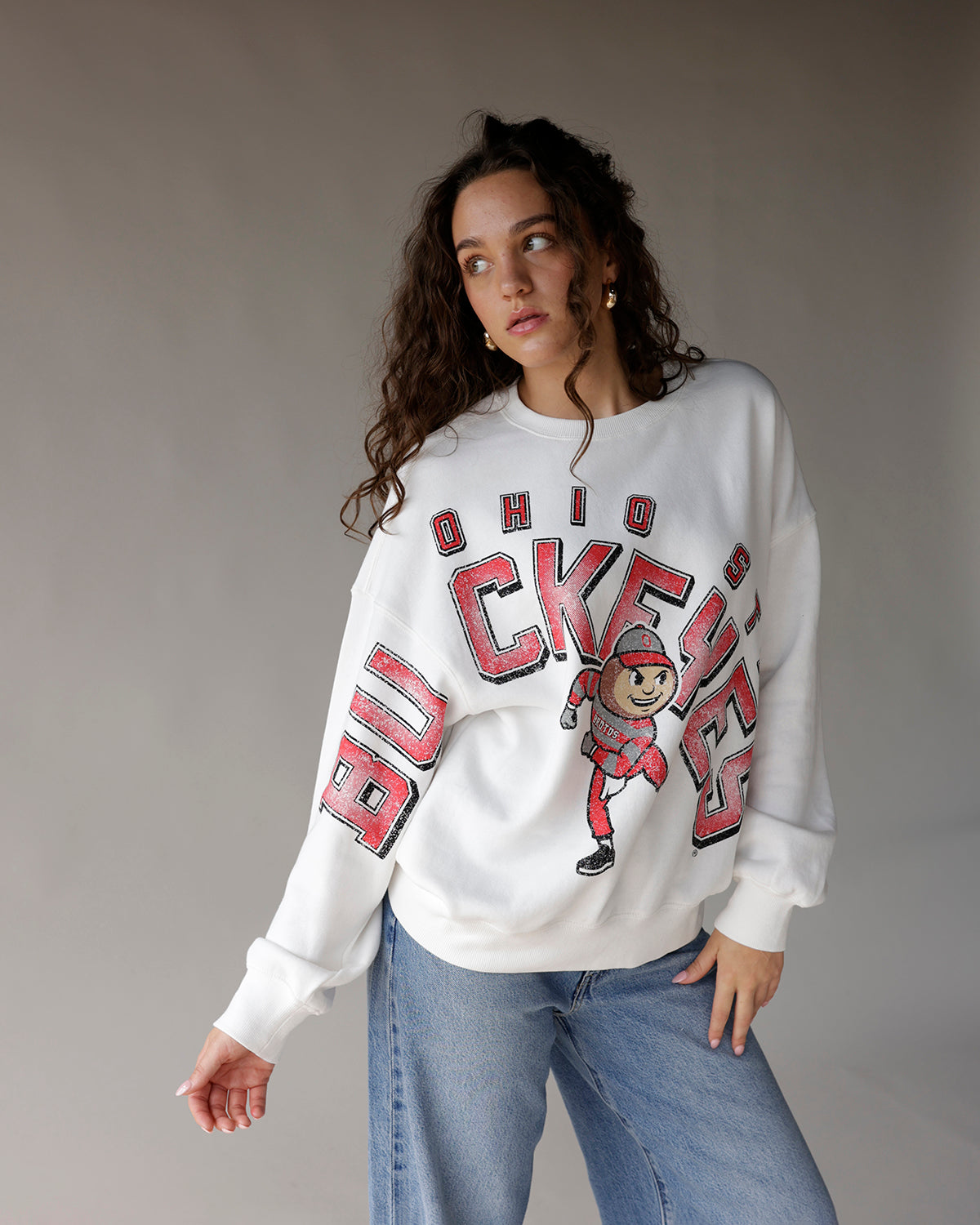 White oversized Ohio State Buckeyes crewneck sweatshirt with Brutus mascot graphic