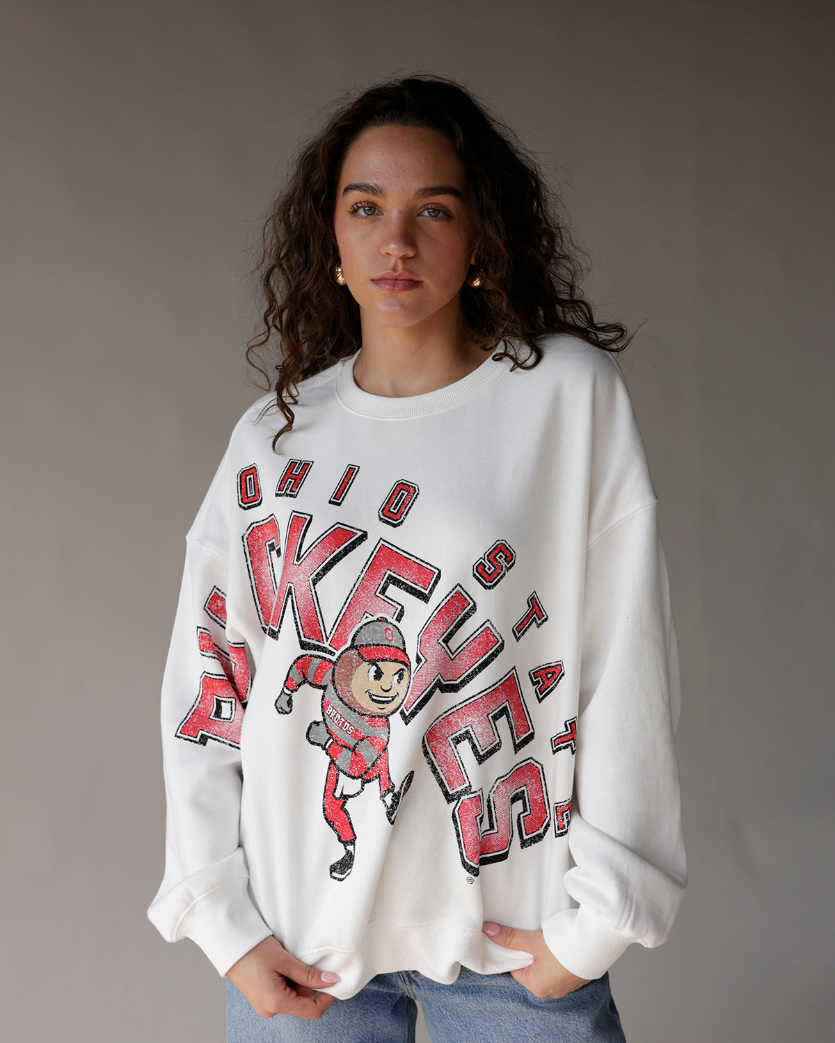 White oversized Ohio State Buckeyes crewneck sweatshirt with Brutus mascot graphic