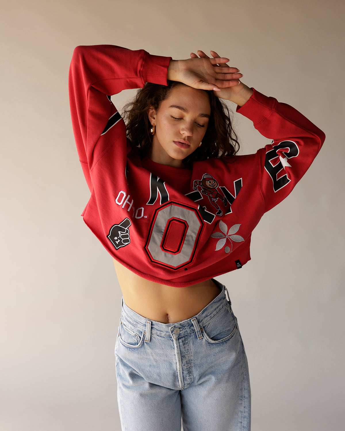 Red cropped Ohio State Buckeyes graphic sweatshirt with large O logo and jeans